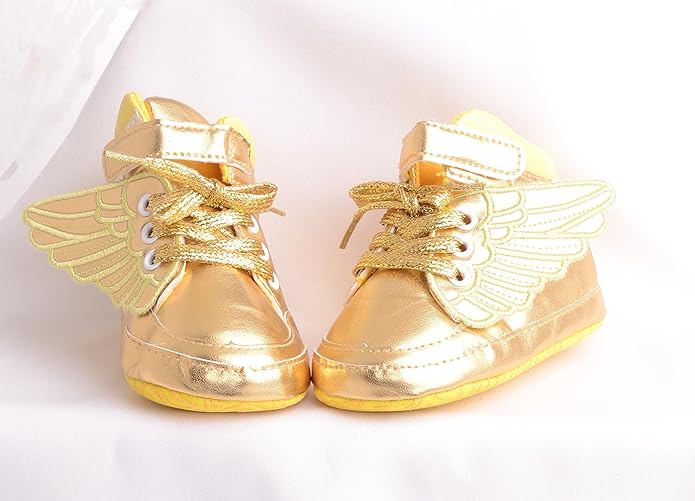 gold sneakers with wings