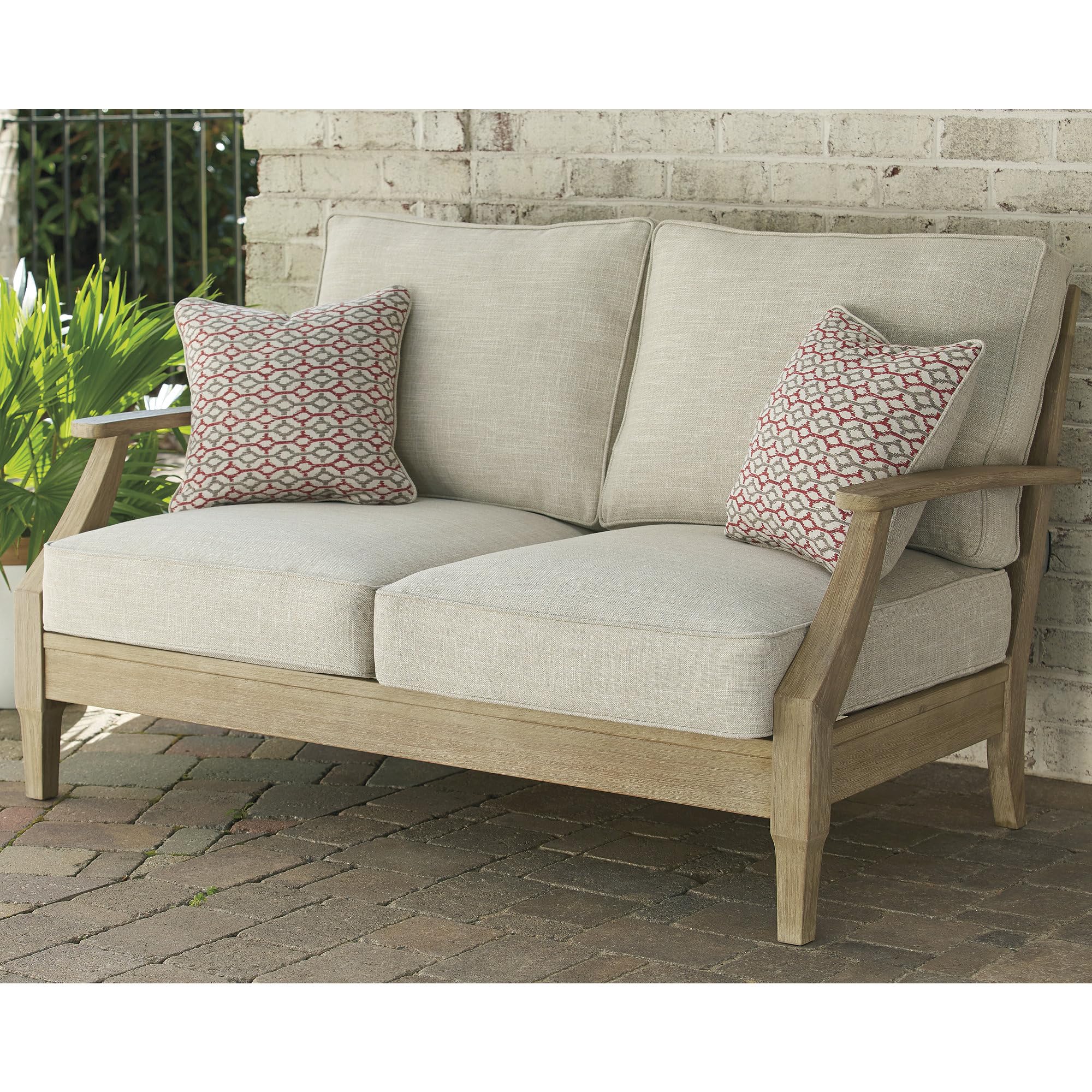 Photo 1 of Signature Design by Ashley Clare View Coastal Outdoor Loveseat, Cushioned with Nuvella Fabric, Protective Finish, Eucalyptus Wood, 55.5" W x 35" D x 32" H, Beige