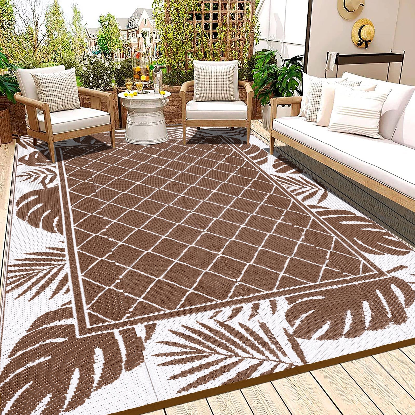 Photo 1 of Ileading Outdoor Rug Carpet for Patio 6' x9' Waterproof Reversible Plastic Straw Rug Portable Outside Area Rug Camping Mat for Patio, Clearance, Balcony, Picnic, Pool, Beach, RV, Deck, Leaf Brown