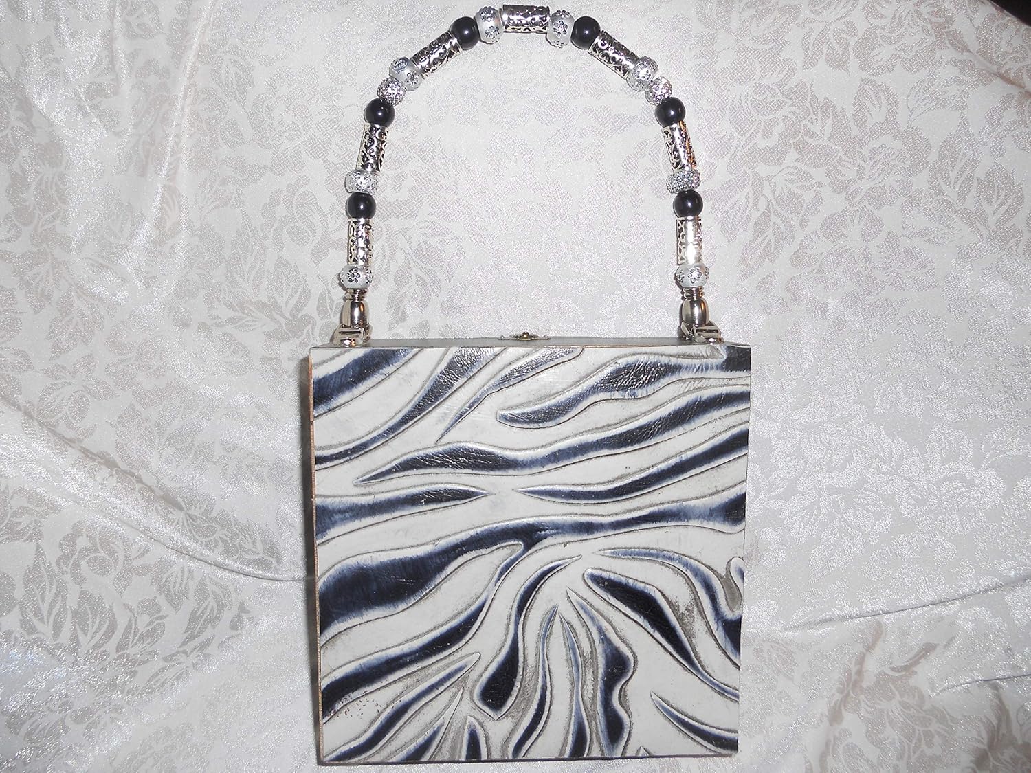black and white snakeskin bag