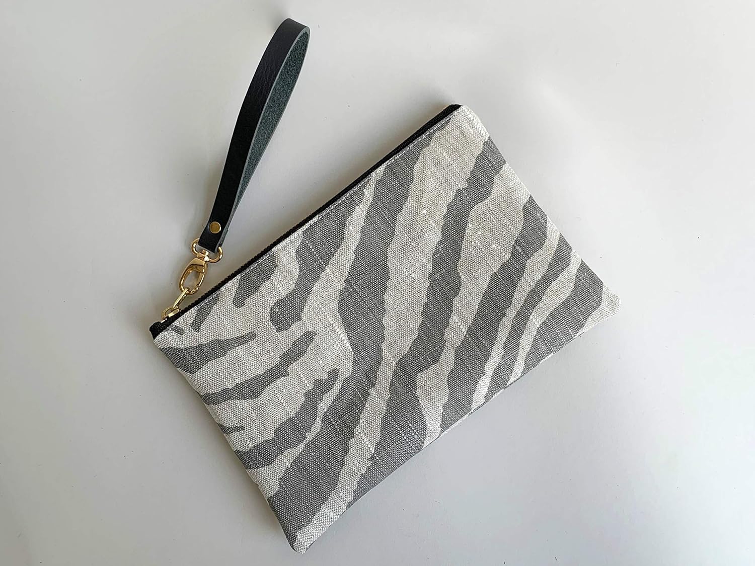 black and white zebra print clutch bag