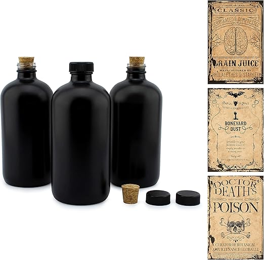 black apothecary bottles with halloween labels for bar cart