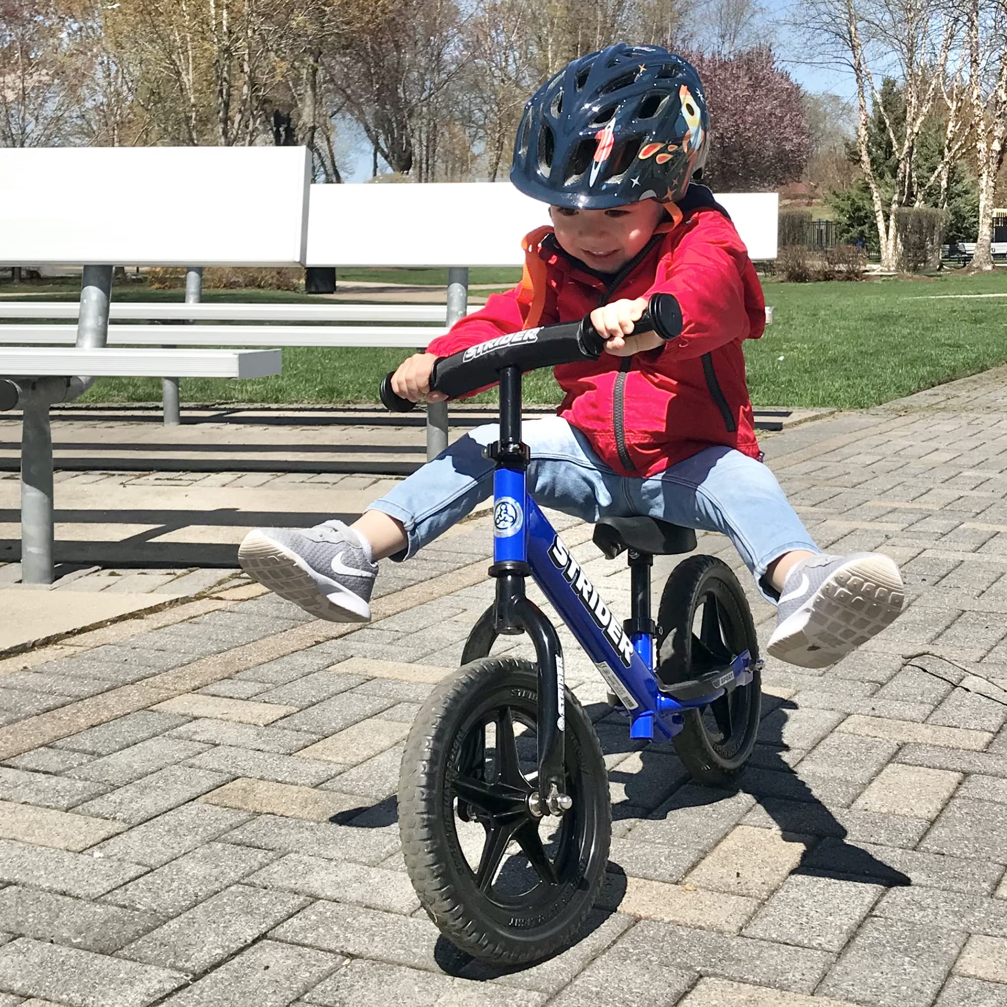 Strider 12” Sport Bike - No Pedal Balance Bicycle for Kids 1 to 4 Years - Includes Safety Pad, Padded Seat, Mini Grips & Flat-Free Tires - Tool-Free Assembly & Adjustments