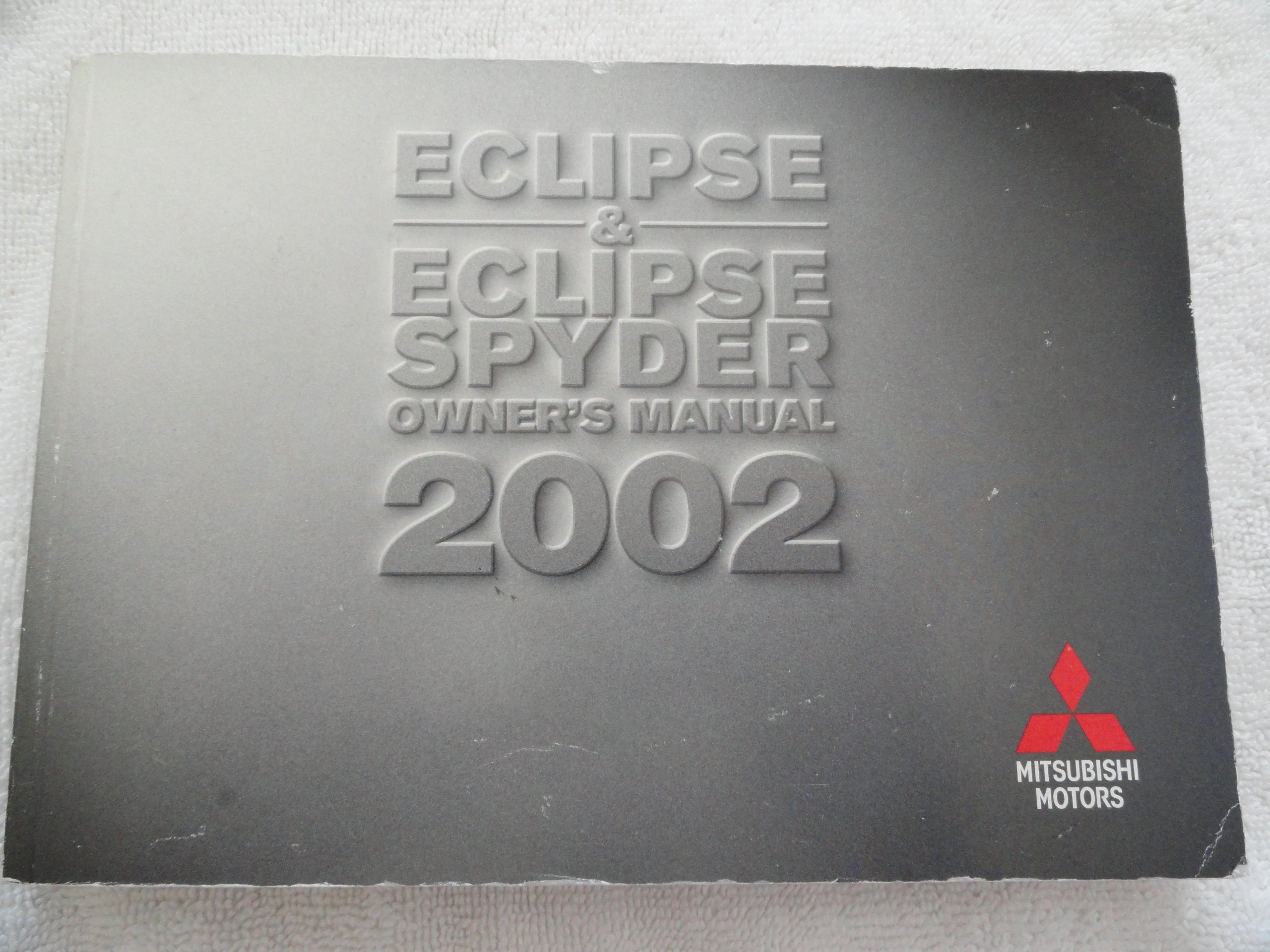 2002 Mitsubishi Eclipse, Eclipse Spyder Owners Manual Paperback – 2002