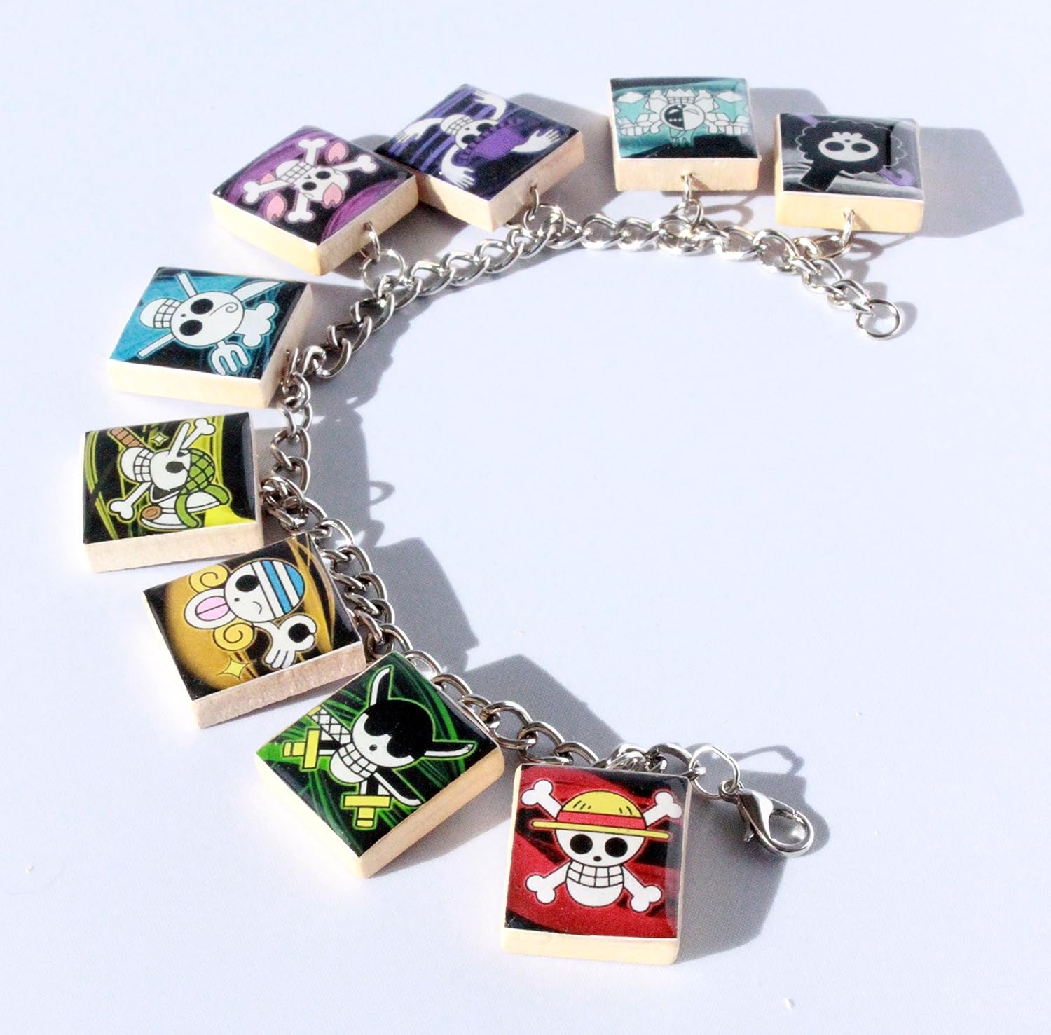 Amazon Com One Piece Jolly Roger Inspired Scrabble Tile Charm Bracelet Anime Inspired Handmade