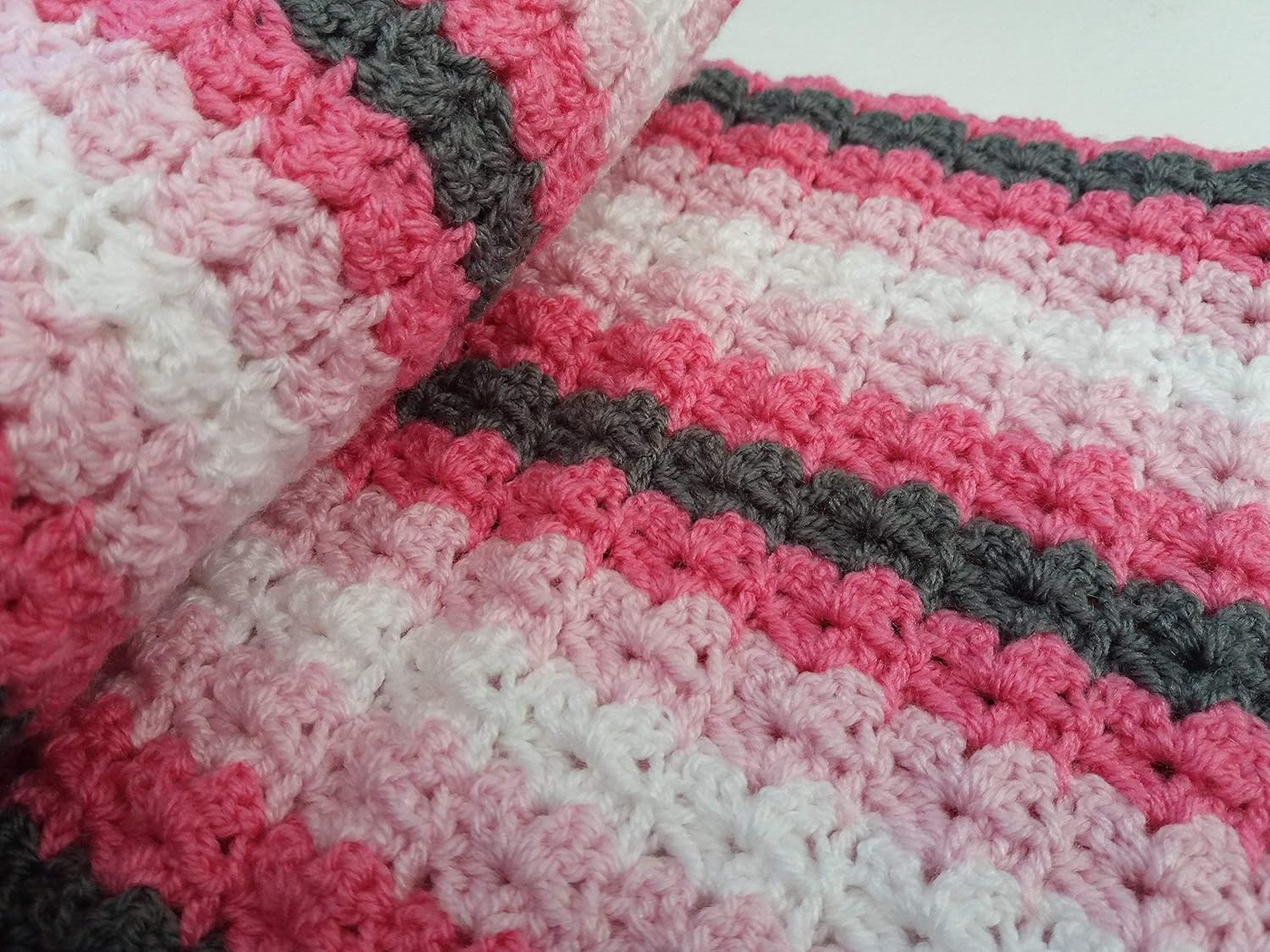 pink grey and white crochet blanket