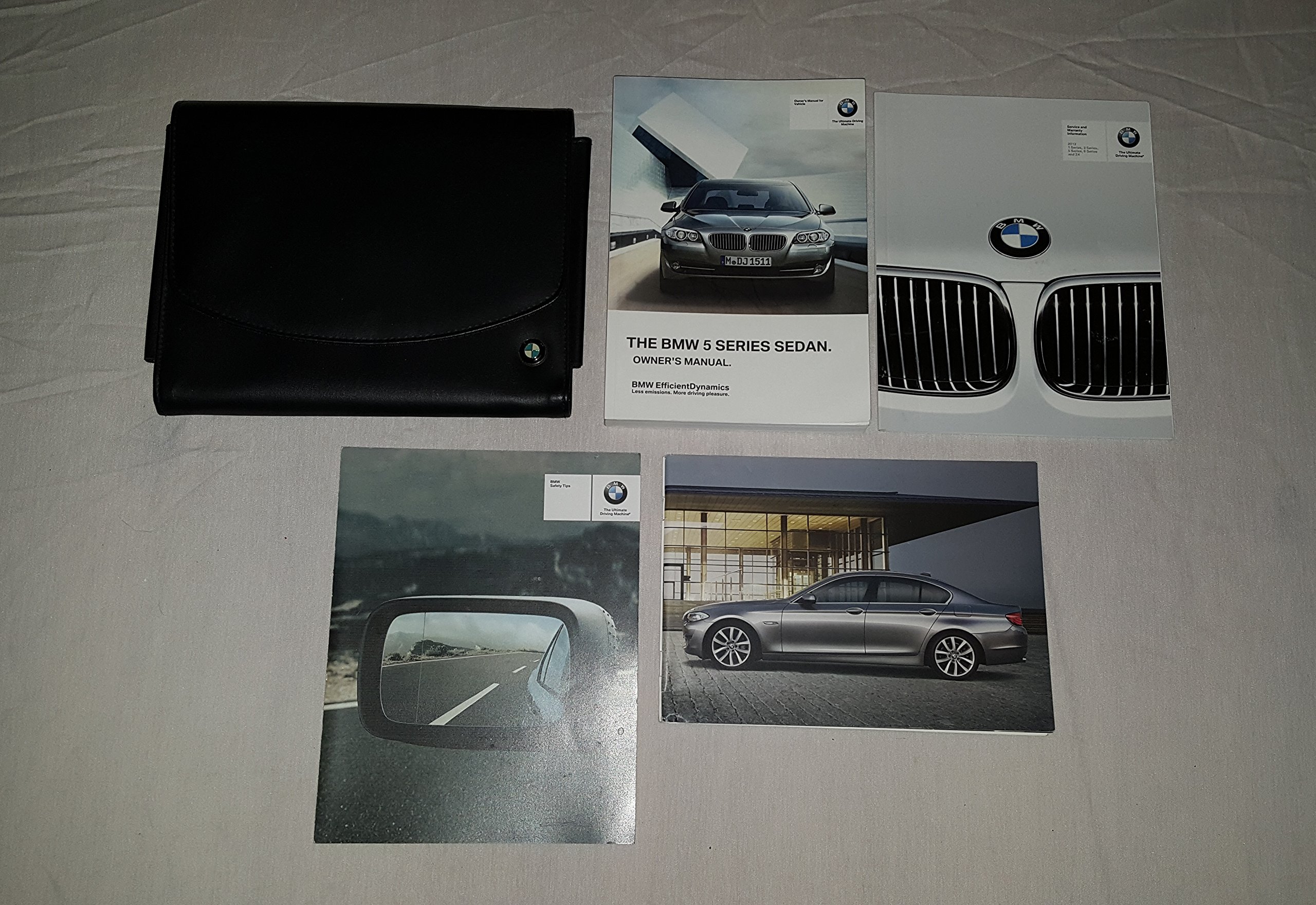 2012 BMW 5 Series Sedan 528i 535i 550i xDrive Owners Manual 04786 Paperback  – 2012