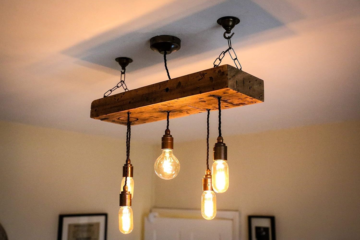 Custom built bespoke ceiling light with reclaimed wood for exposed