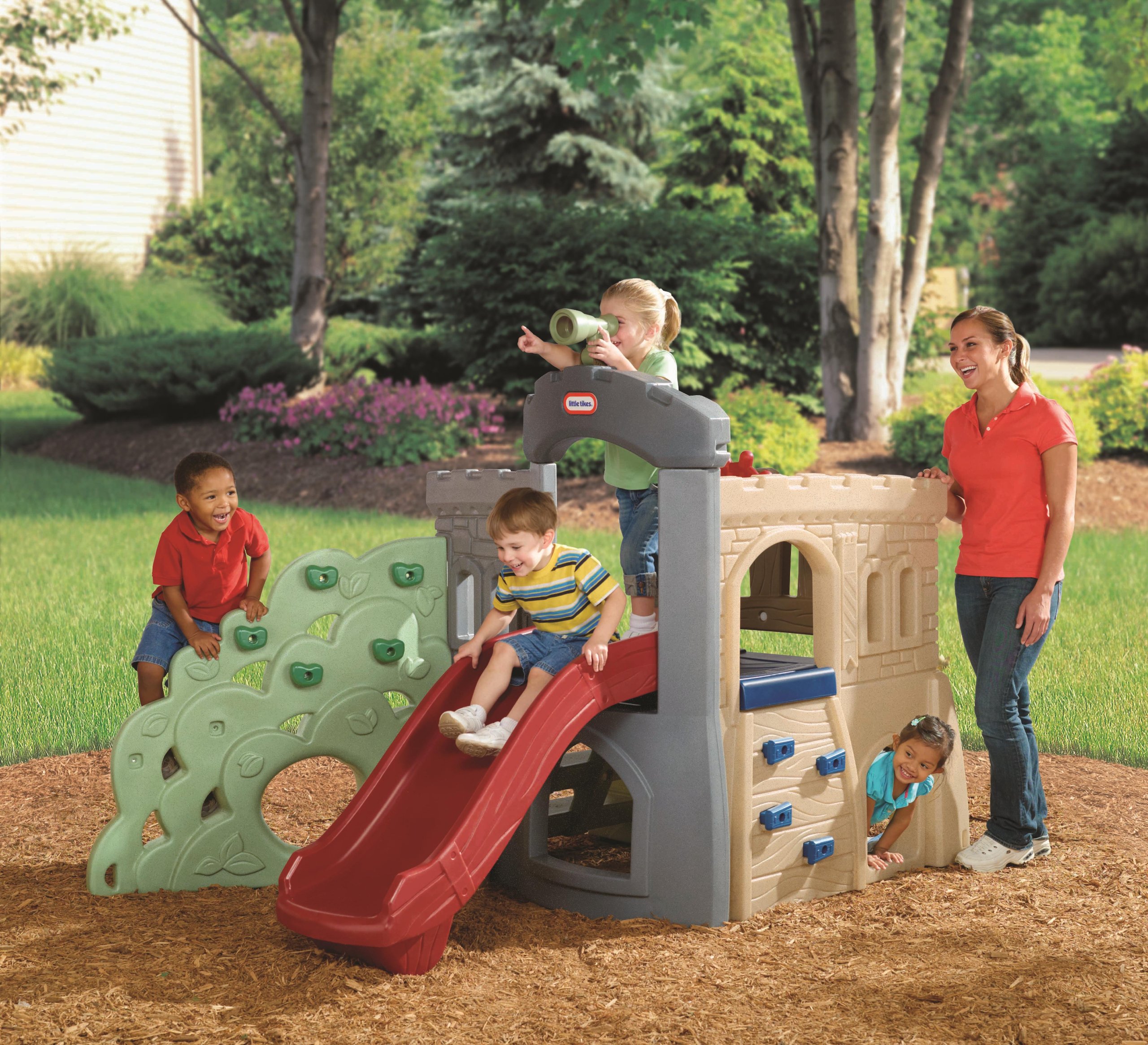 Children playing on Little Tikes Rock Climber and Slide
