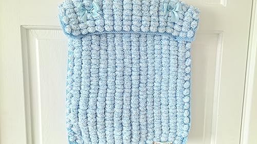 pom pom knitted baby blanket