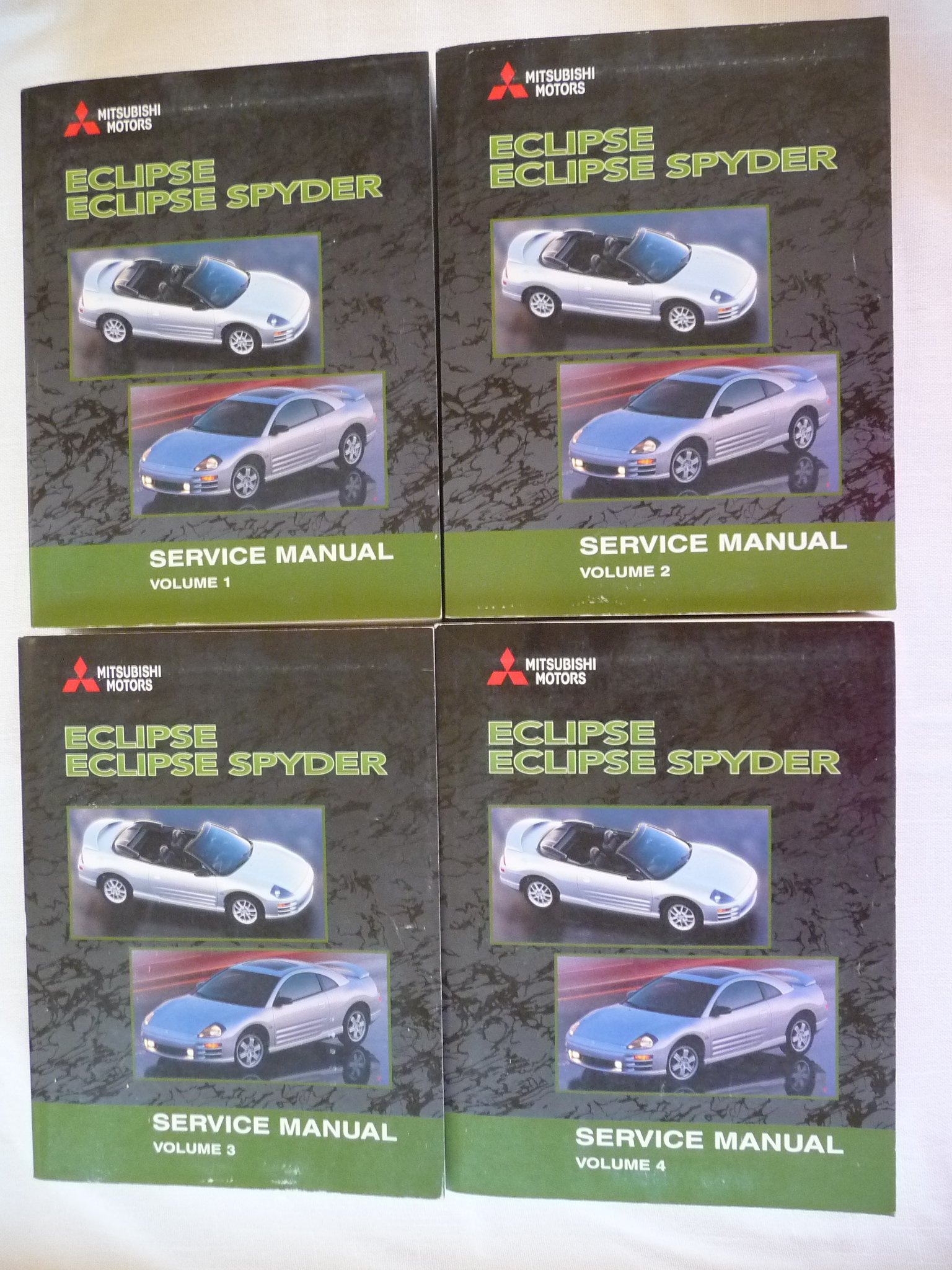 2002 Mitsubishi Eclipse Spyder Shop Service Manual Set (4 Volumes )  Paperback – 2002