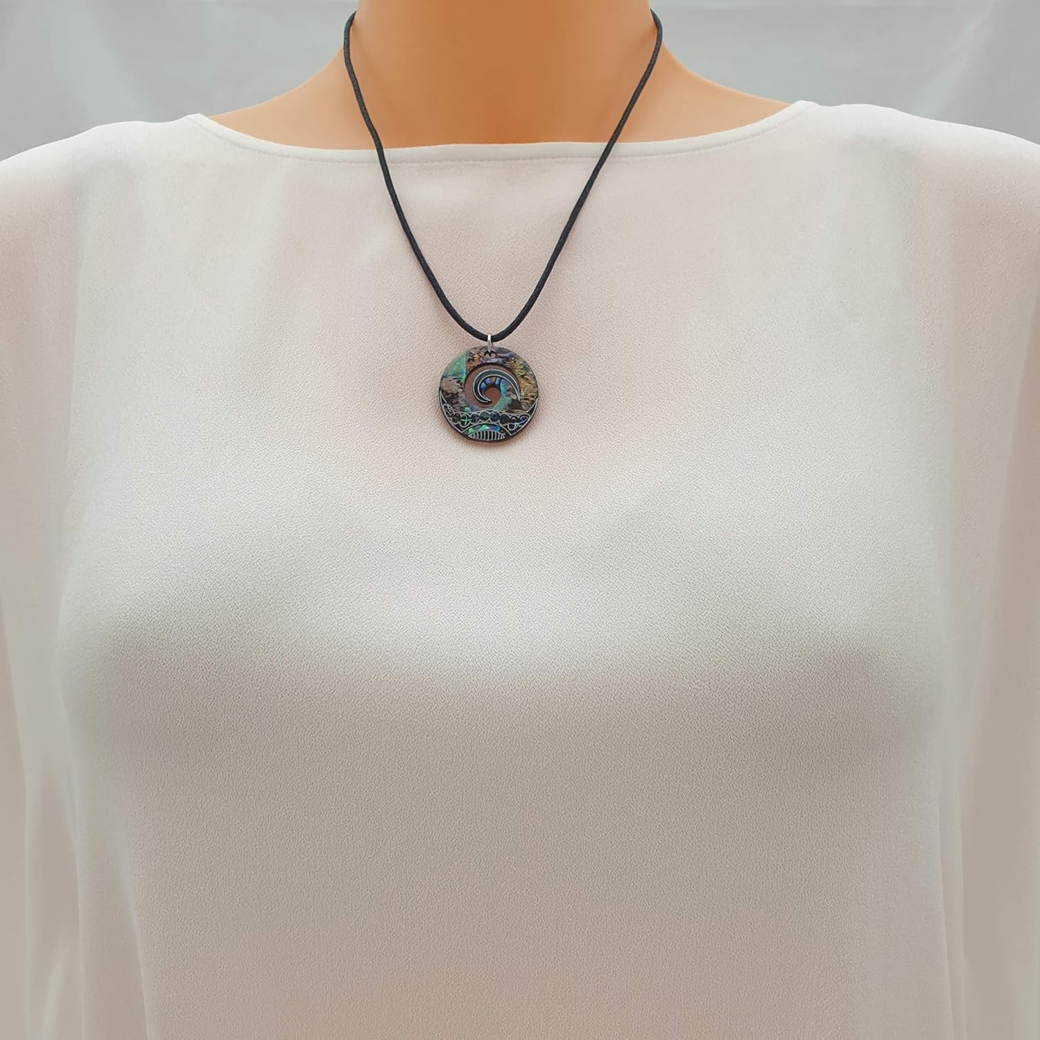 Kiara Jewellery Maori Koru or Wave Crest Pendant Necklace Inlaid With Bluish Green Paua Abalone Shell on 18" Black Cord On Black Plastic Back Disc - Image 3