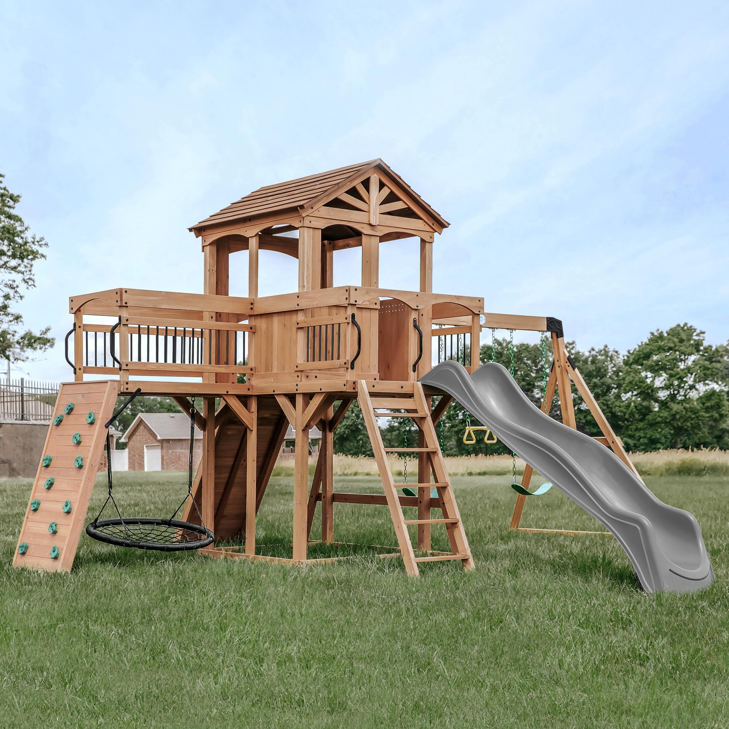 Photo 1 of **WILL NEED A TRUCK FOR PICKUP**Backyard Discovery Sterling Point Cedar Wood Swing Set with Wave Slide, Raised Clubhouse, Wooden Bridge, Rock Wall, Belt Swings, Web Swing, Trapeze, Balcony, Climbing Wall, Ladder, Outdoor Playset