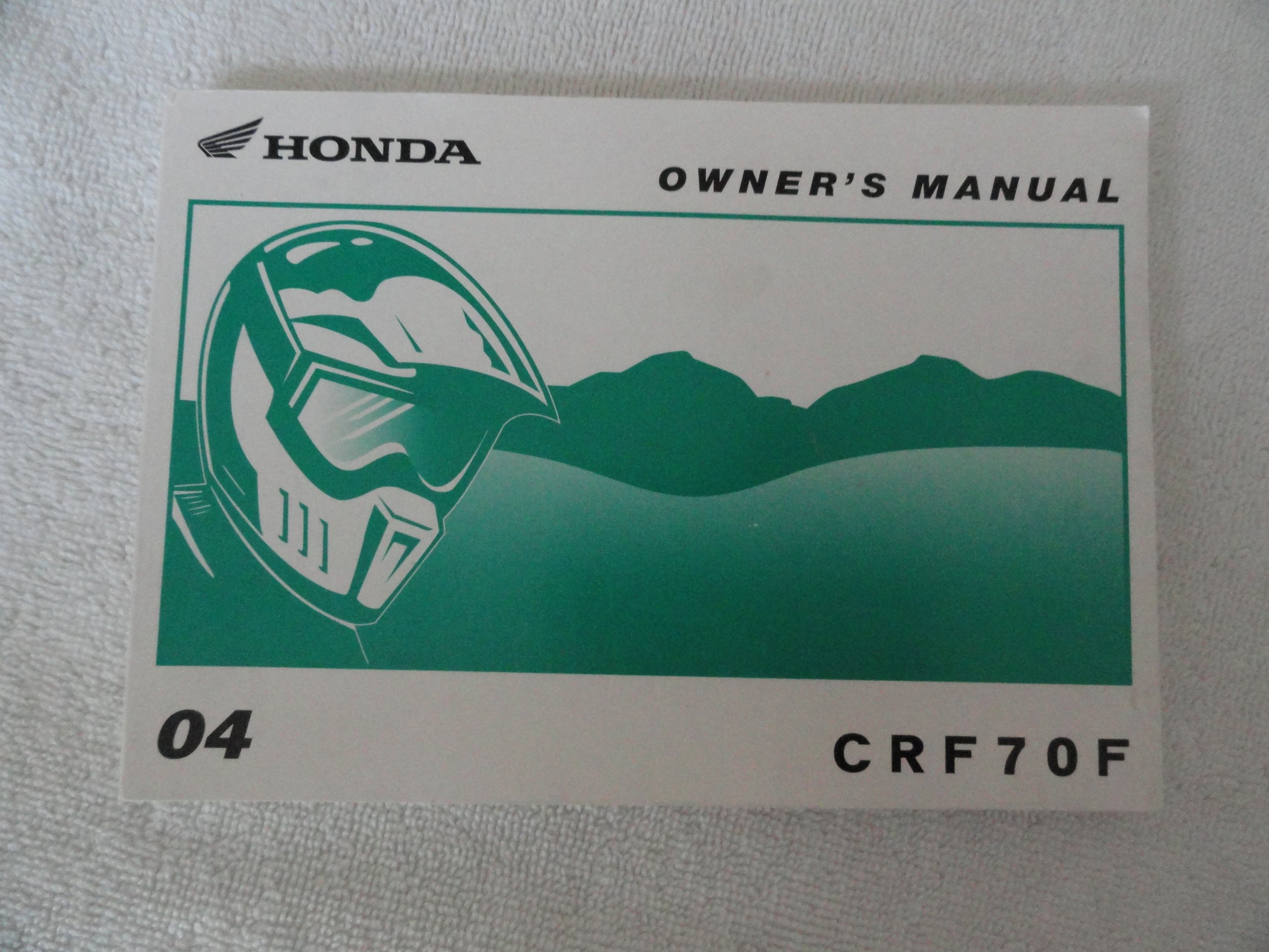 2004 Honda CRF70 Owner's Manual CRF 70 F Paperback – 2004
