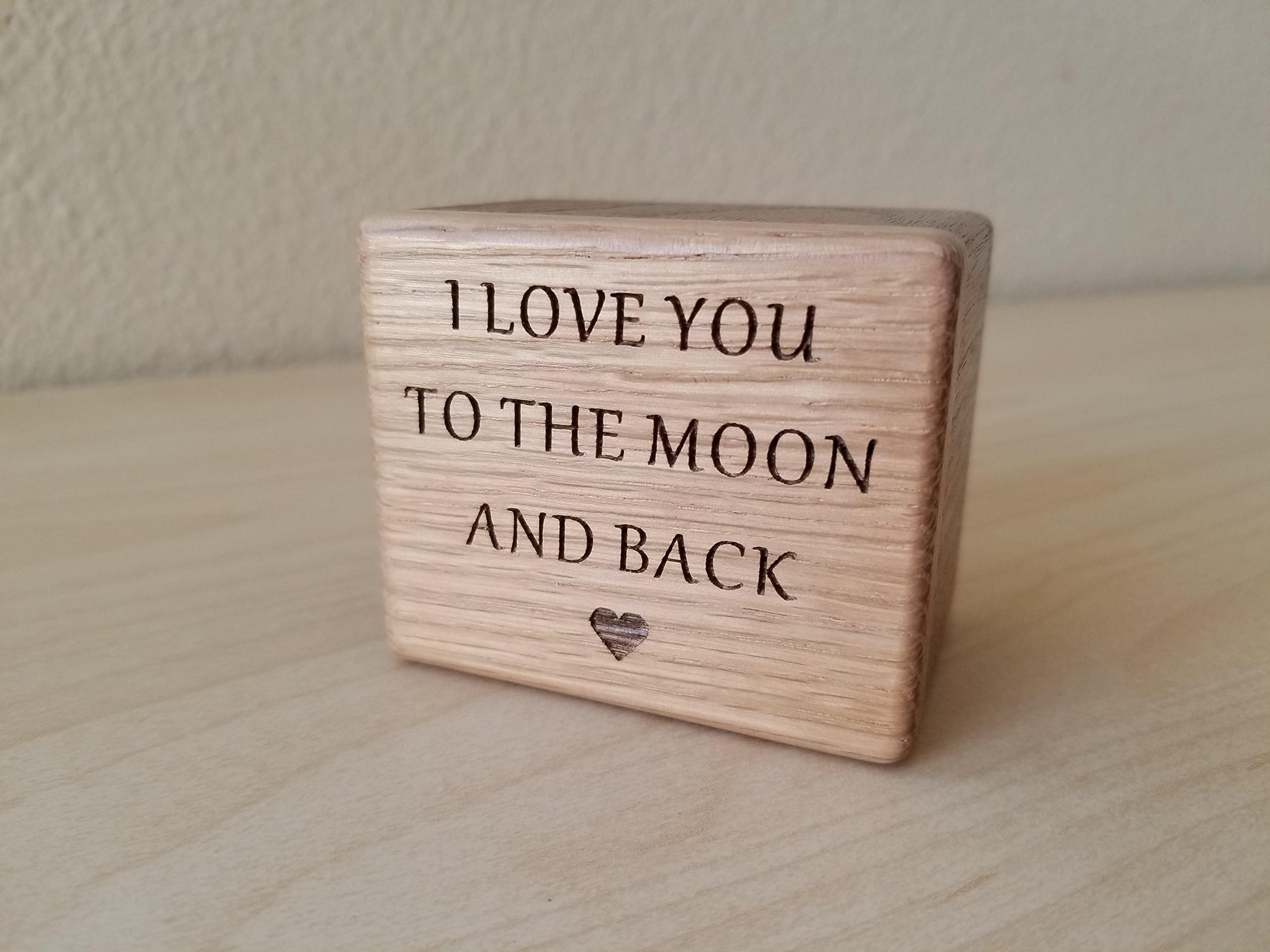 Wooden music block with I love you to the moon and back engraved to the front, playing the song You are my sunshine