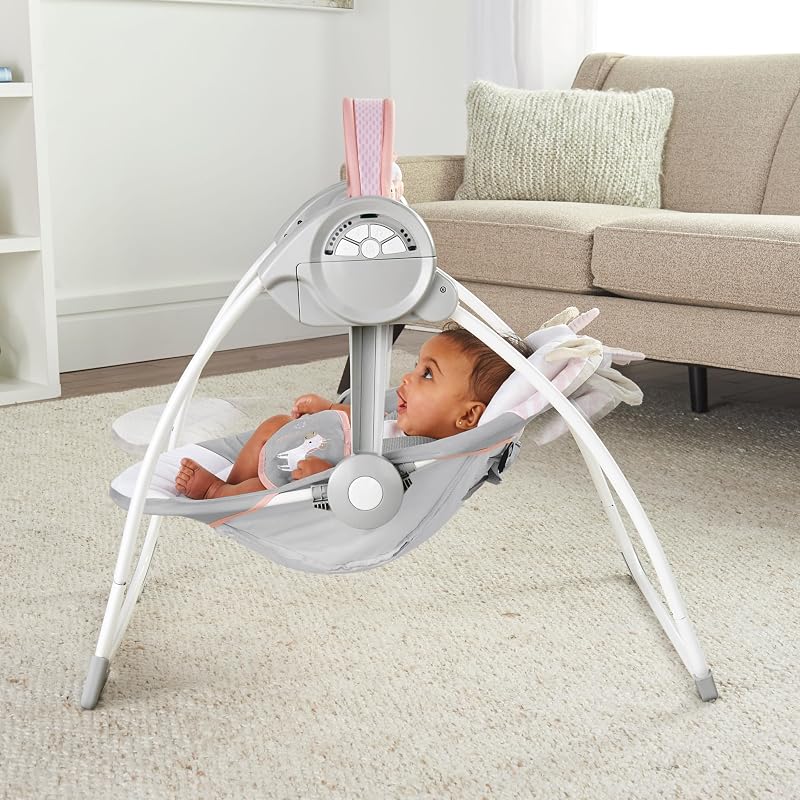 , Columpio Compacto y Plegable Flora el Unicornio, 6 velocidades de balanceo, temporizador, 12 melodías, arco de juegos extraíble, rosa, desde recién nacido hasta los 9 kg, 1 Unidad
