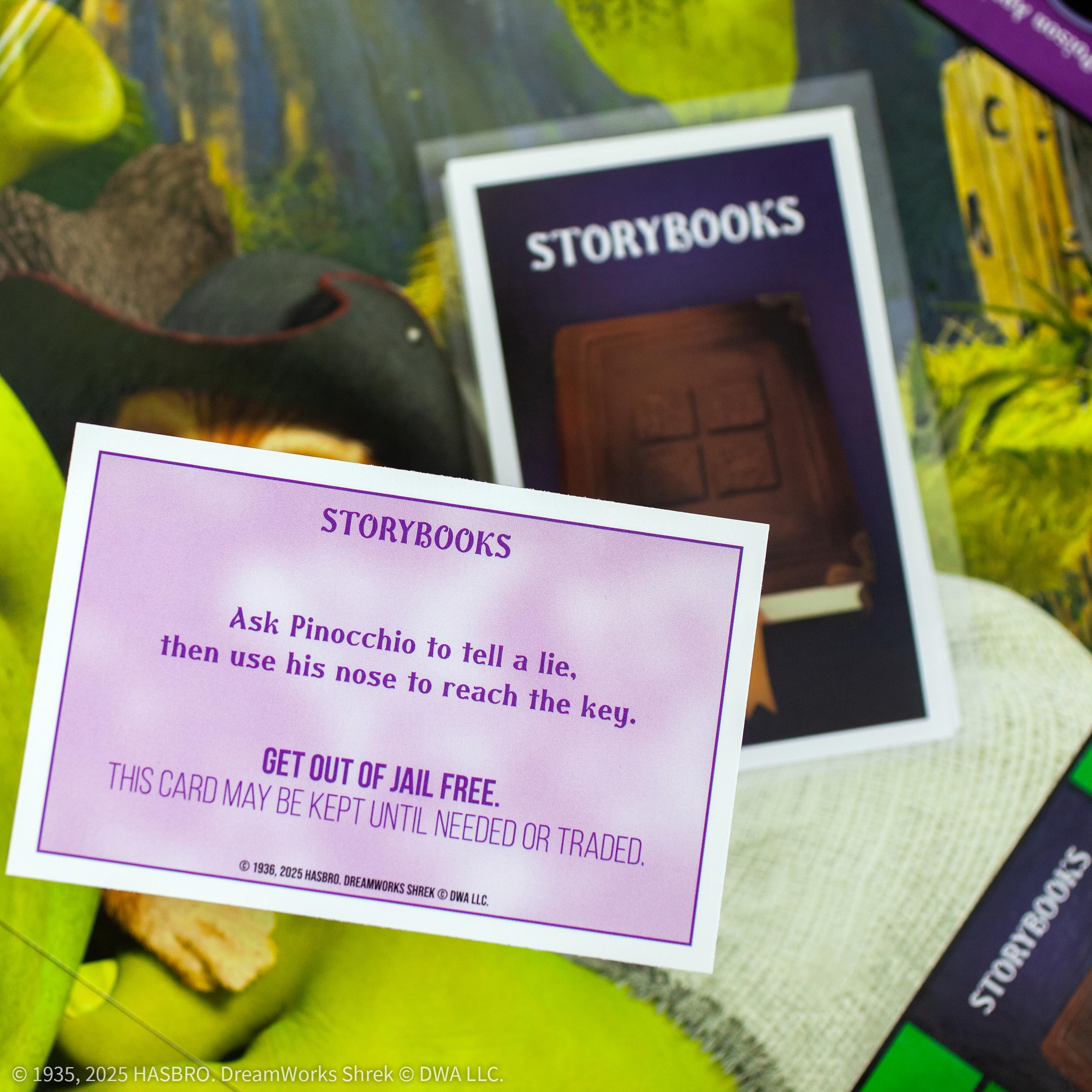 MONOPOLY: Shrek Edition Board Game, Buy, Sell & Trade, Iconic Fairy Tale Characters like Shrek, Donkey, Puss n Boots & More, Classic Family Game for Ages 8+, Officially Licensed DreamWorks Merchandise