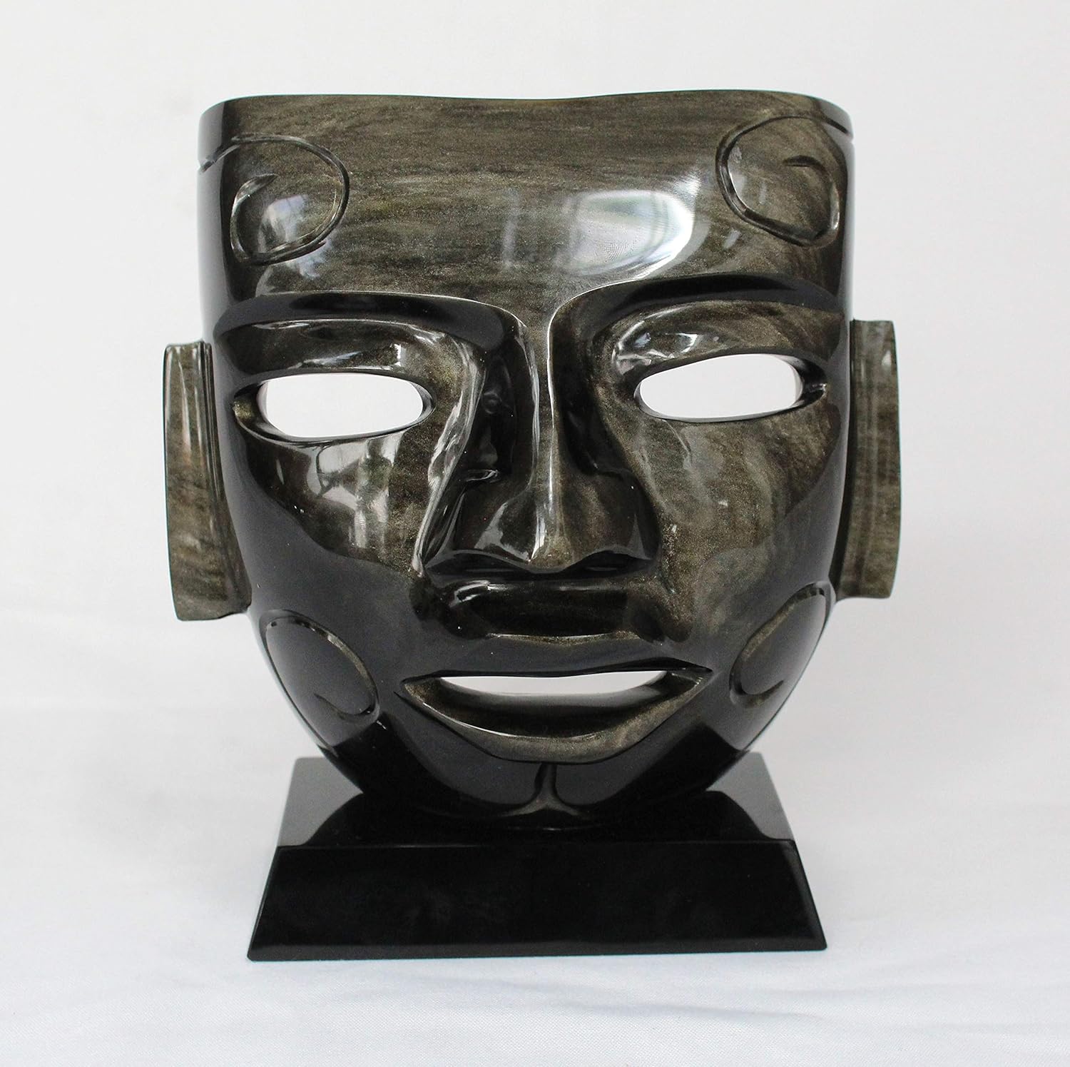 Artesanía, mascara teotihuacana vaciada en obsidiana dorada con virgula