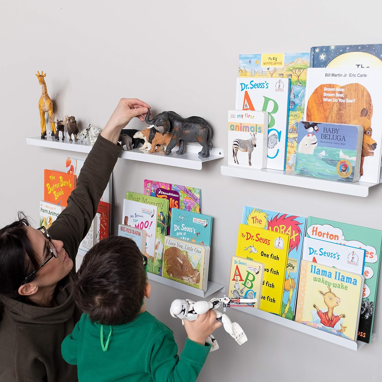 white floating bookshelves nursery