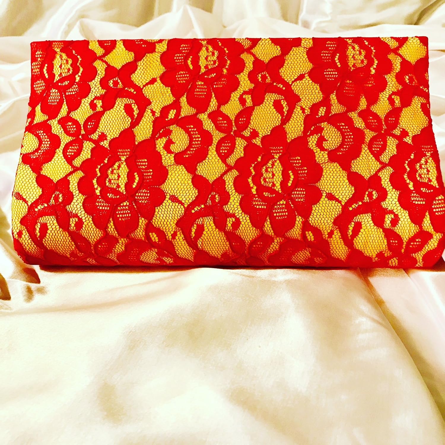 red and gold clutch bag