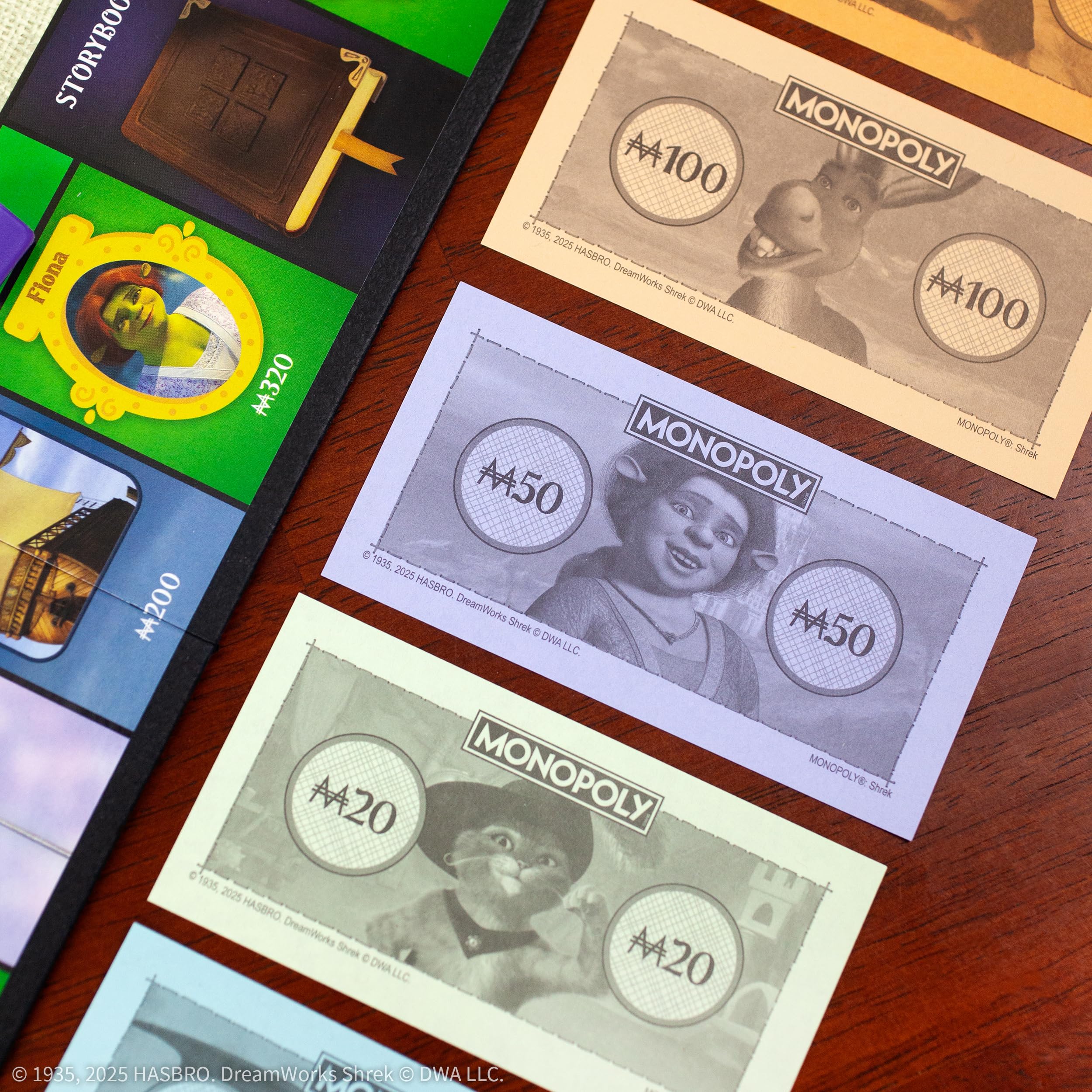 MONOPOLY: Shrek Edition Board Game, Buy, Sell & Trade, Iconic Fairy Tale Characters like Shrek, Donkey, Puss n Boots & More, Classic Family Game for Ages 8+, Officially Licensed DreamWorks Merchandise