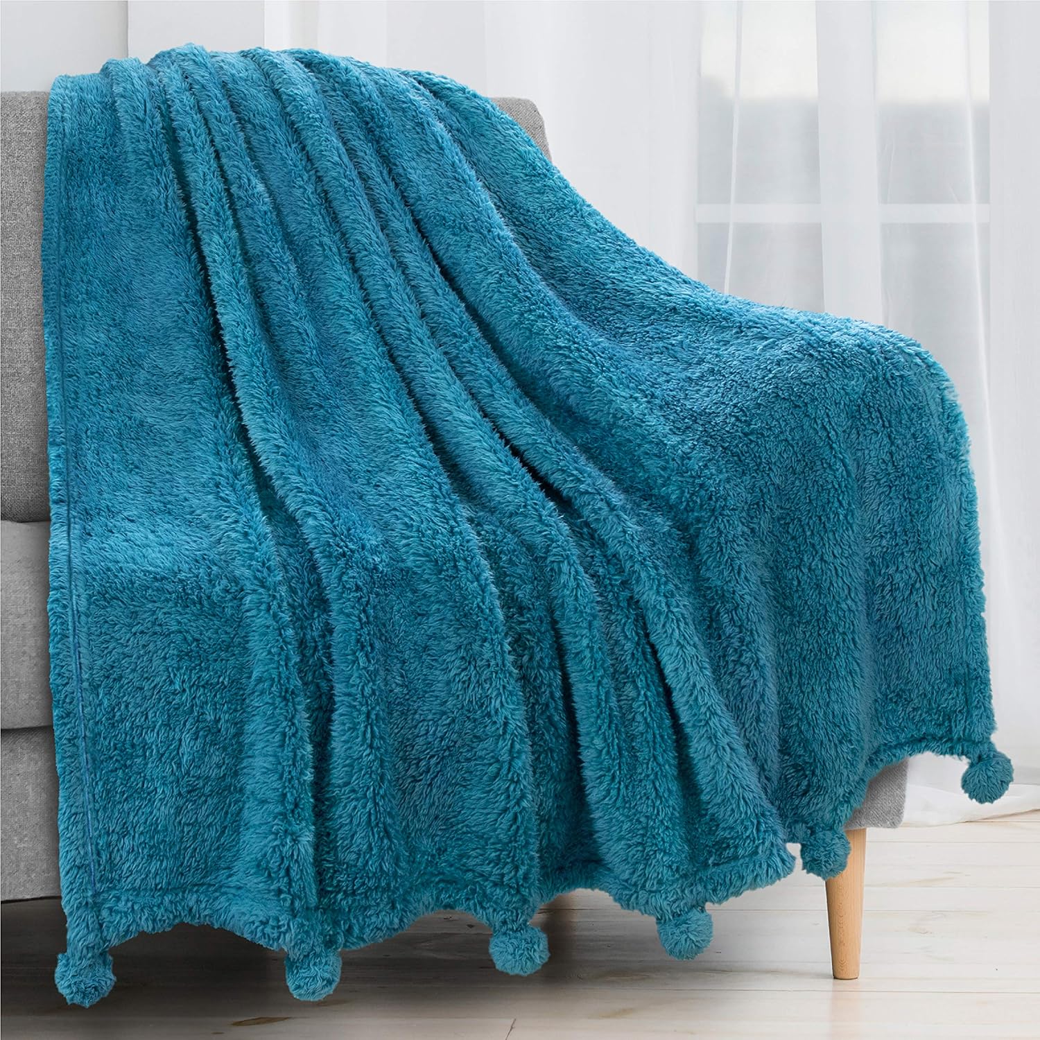 PAVILIA Plush Sherpa Throw Blanket with Pom Pom Fringe, Blue Turquoise | Fluffy Fleece Tassel Throw for Sofa Bed Couch | Soft Fuzzy Shaggy Lightweight Decorative Blanket | 50 x 60 in
