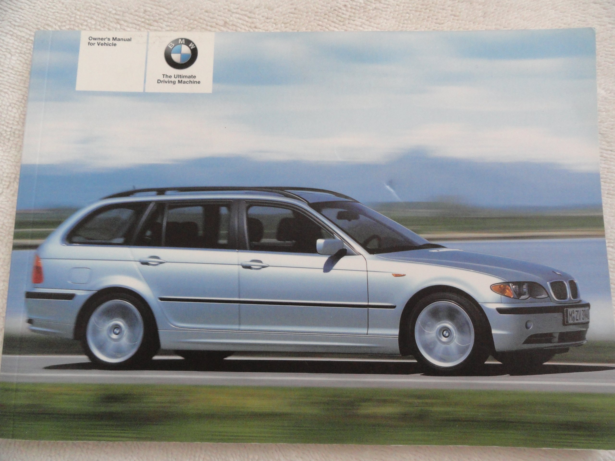 2005 BMW 325i and 325xi Owner's Manual Paperback – 2005