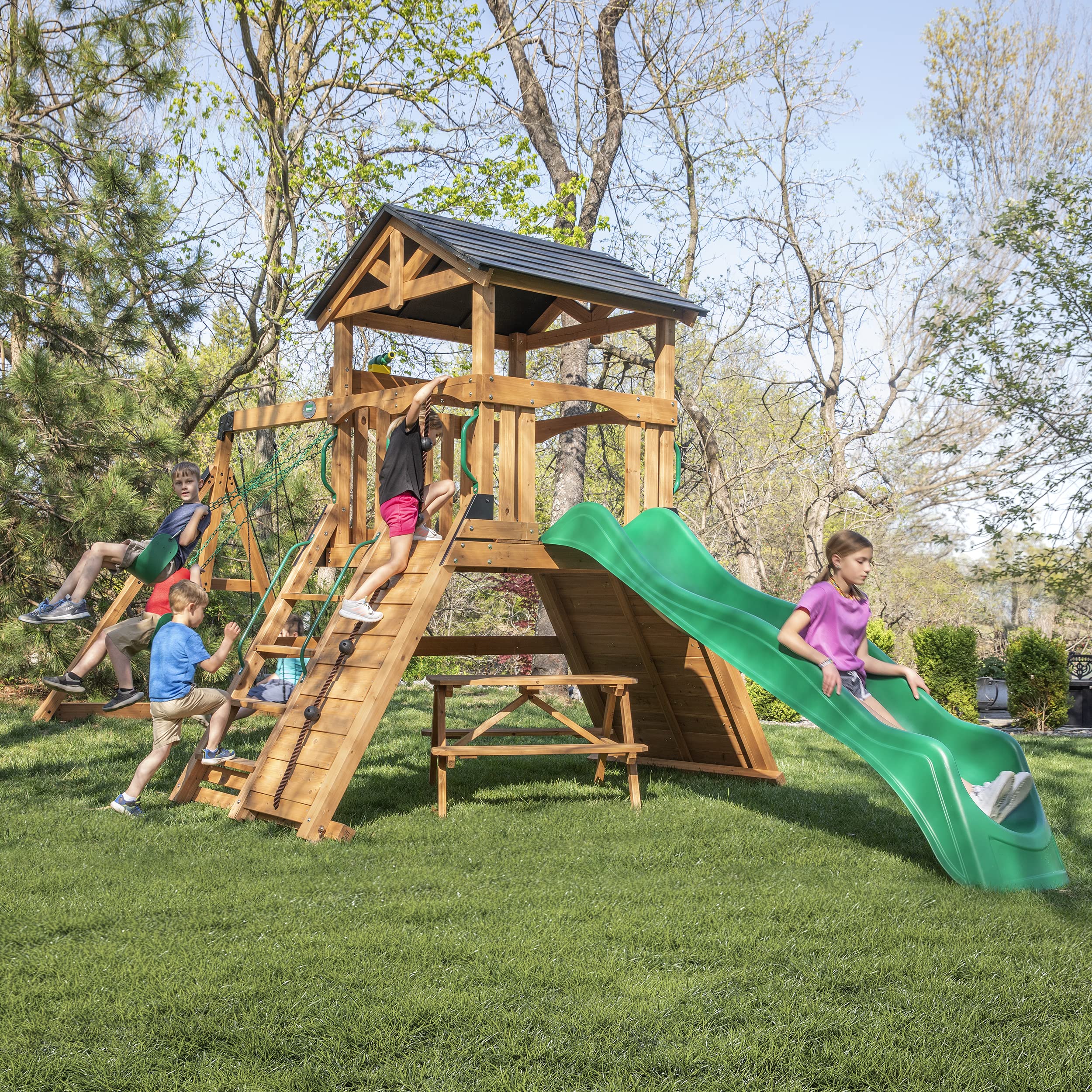 Photo 1 of Backyard Discovery Endeavor II Cedar Wood Swing Set with Wave Slide, Play Deck, Double Rock Wall, Picnic Table, Climbing Wall, Belt Swings, Web Swing, Toy Telescope, Step Ladder, Outdoor Playset