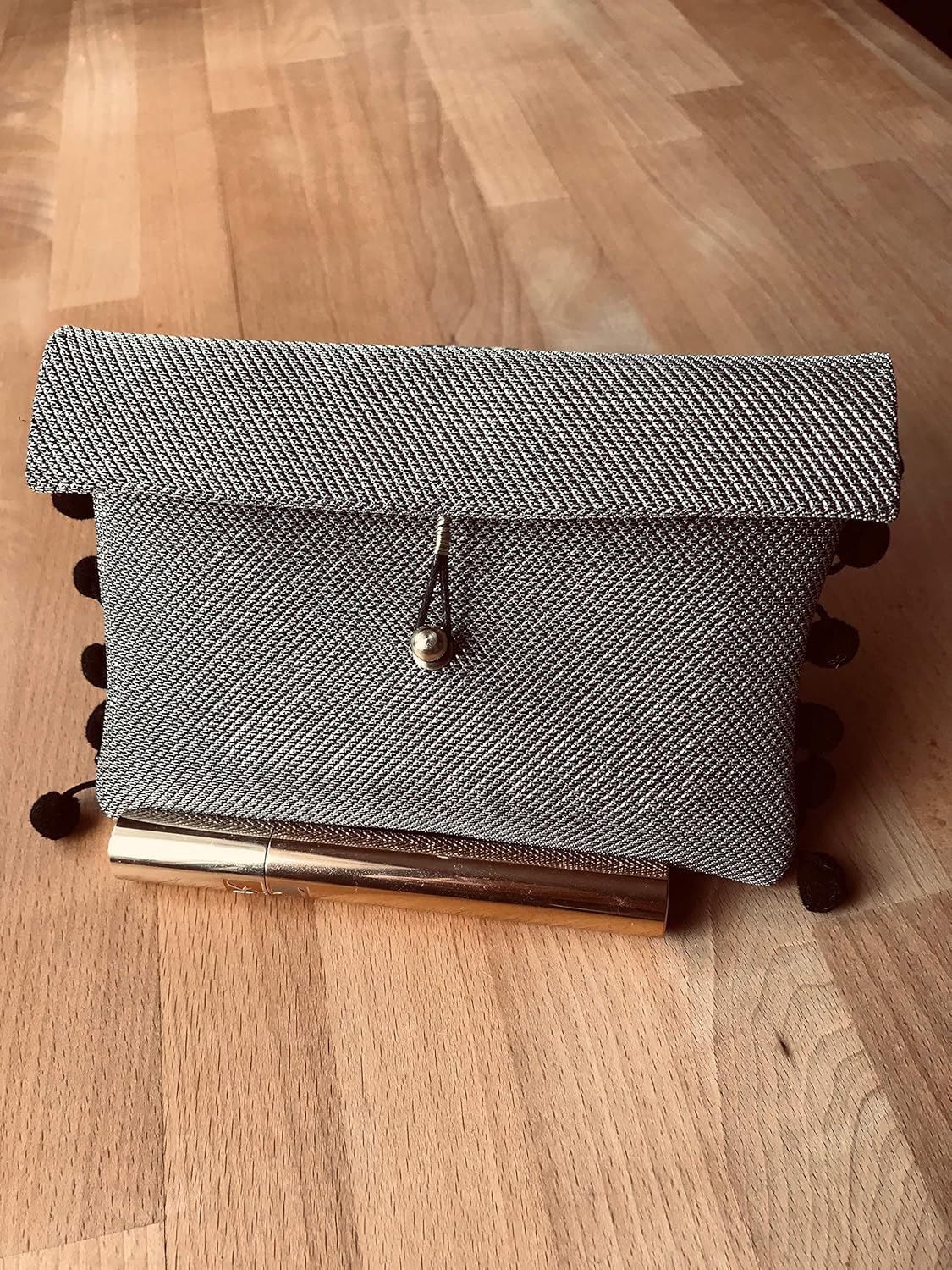 shiny gold clutch bag