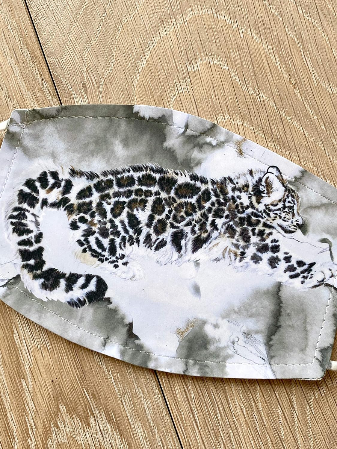 Cute snow leopard jumping mask