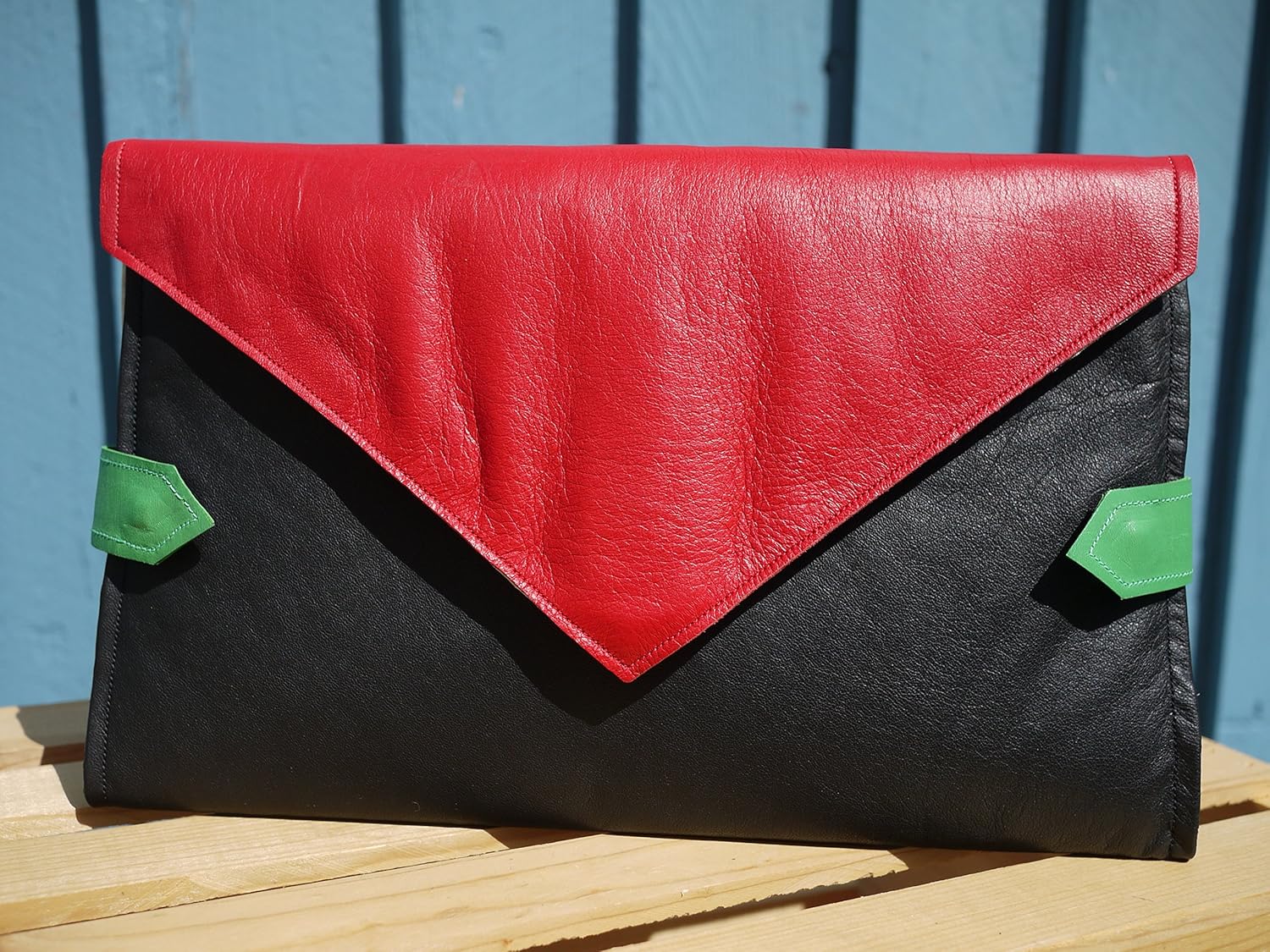 green and black purse