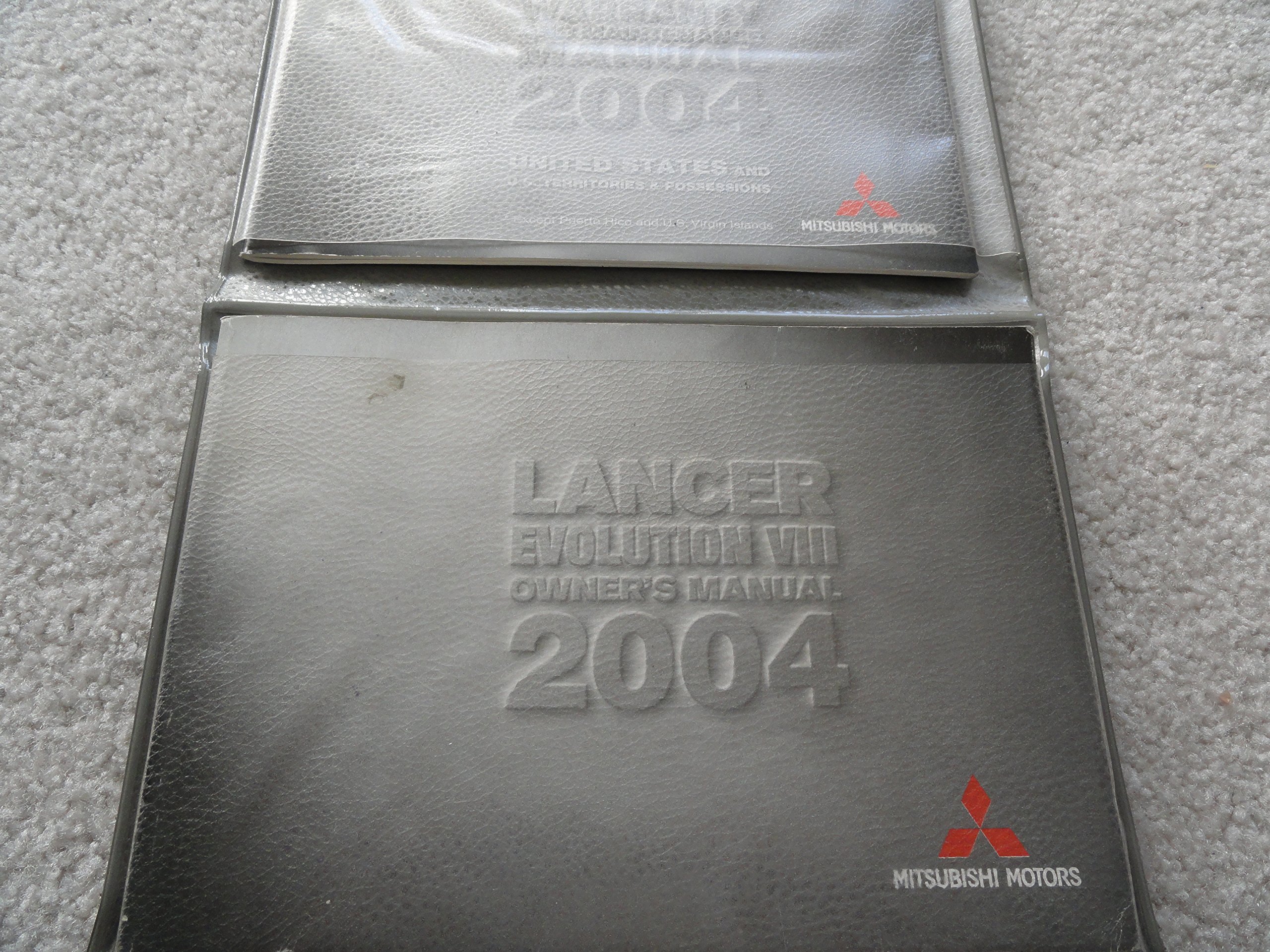 2004 Mitsubishi Lancer Owners Manual Paperback – 2004