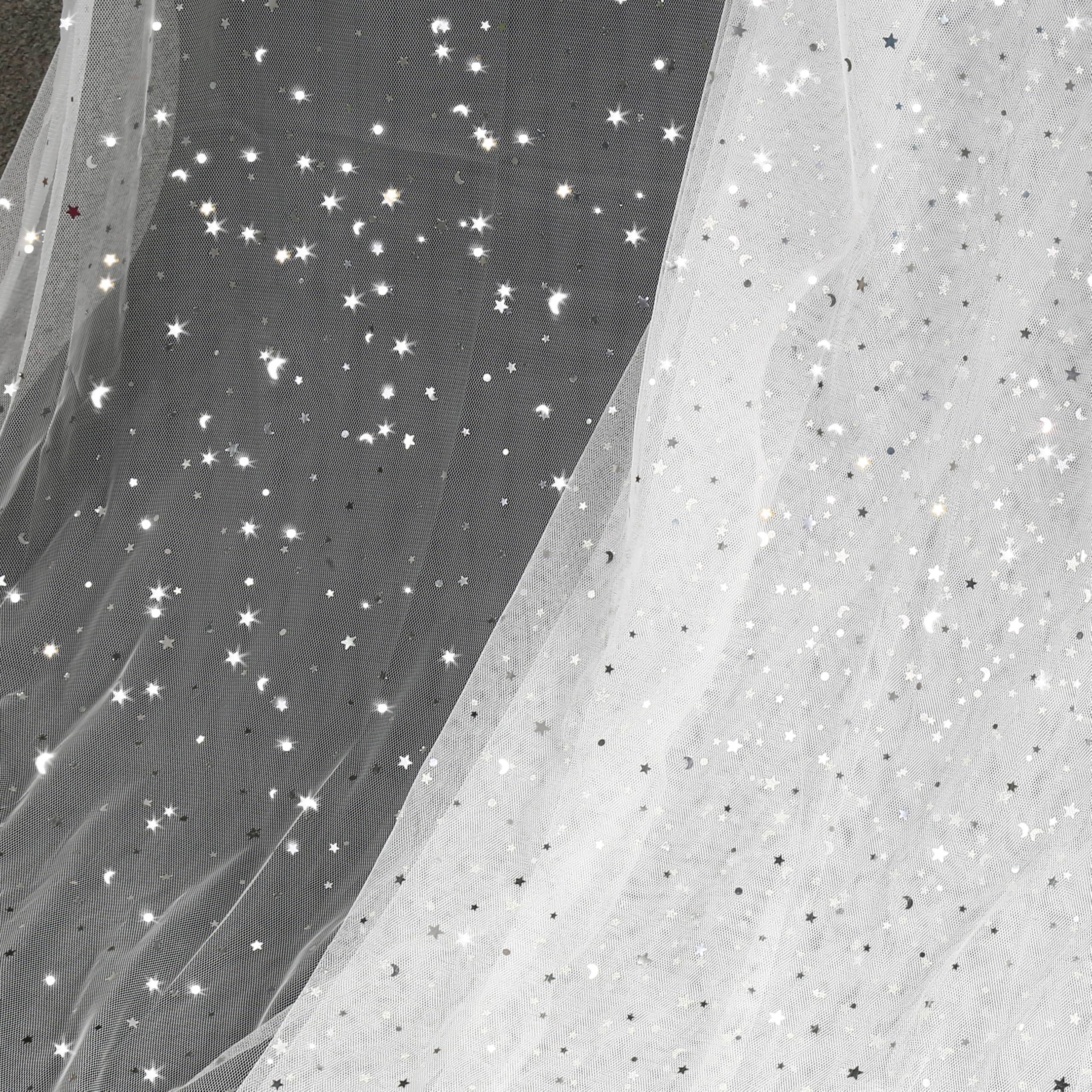 Photo 1 of Homiest Glitter Tulle Fabric Rolls with Star Moon Sequin, 10 Yards x 54 Inch Wide Tulle Bolt White Tulle Rolls Bulk, Tulle Netting Fabric for Tutu Skirt Bridal Veil Wedding Arch Party Decorations