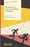 The Game of Cops and Robbers on Graphs