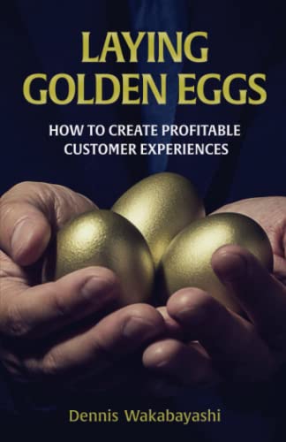 Laying Golden Eggs book with a stack of copies
