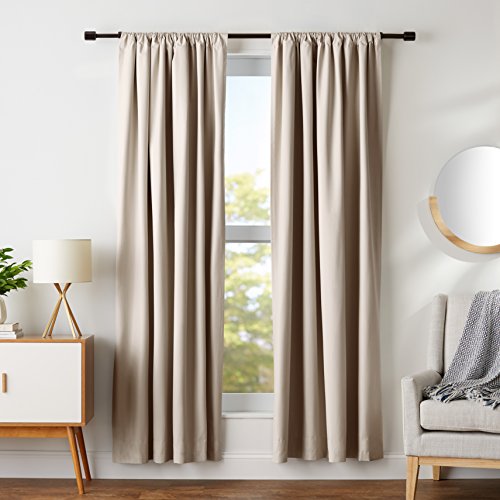 Linen curtains in living room with natural light filtering through