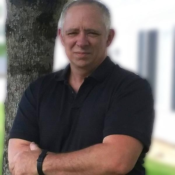 Author photo for Robert Wright Jr. a white man with gray hair in a black polo