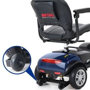 Image showing the Metro Mobility M1 LITE scooter disassembled into parts and stored in a car trunk