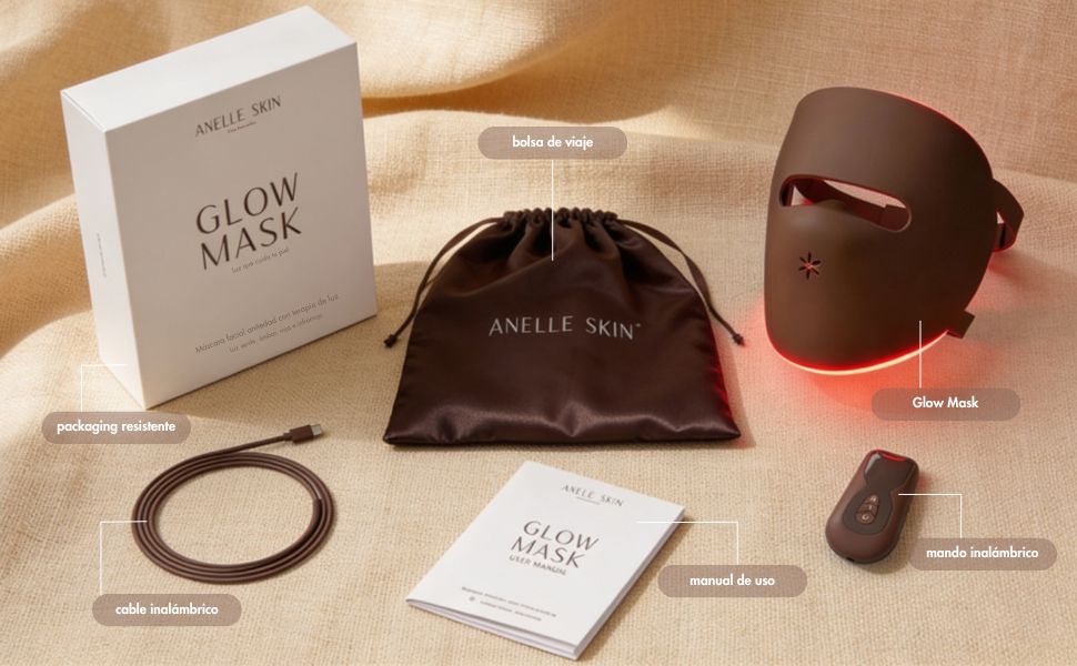 O texto diz «GLOW MASK» e «AMELIE SKIN». A coleção de produtos cosméticos inclui uma caixa branca, um recipiente de cor bordeaux escuro/grená, uma fita para o cabelo e pequenos recipientes para produtos dispostos sobre uma superfície de cor bege.