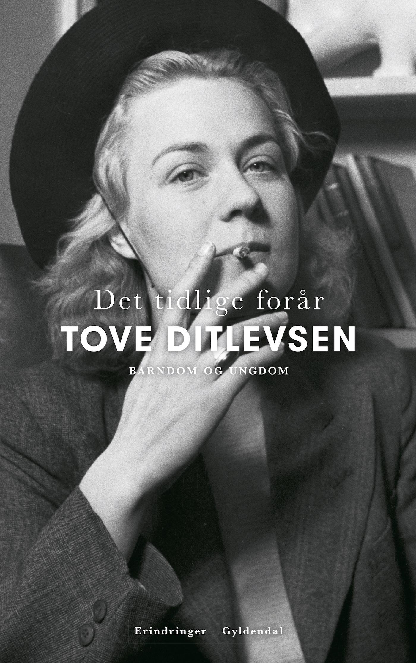 black and white photo of a woman with a wide brim had smoking