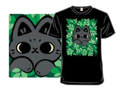 Cute Black Cat Peeking Through Green Leaves