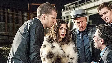 The Four Horsemen (Jesse Eisenberg as J. Daniel Atlas, Woody Harrelson as Merritt McKinney, Lizzy Caplan as Lula May, Dave Franco as Jack Wilder) interrogating a guy in the Now You See Me 2 game