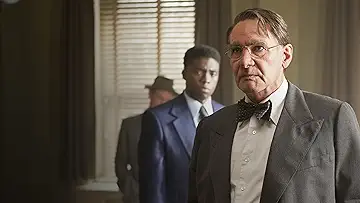 Harrison Ford's Branch Rickey talks to Chadwick Boseman's Jackie Robinson in the 42 game.