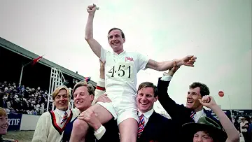 Harold Abrahams (Ben Cross) is hoisted up by Eric Lidell (Ian Charleson), Aubrey Montague (Nicholas Farell) and more in celebration on the poster for the Chariots of Fire game.