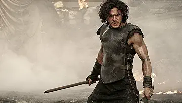 Milo (Kit Harington) poses stoically on the poster for the Pompeii game