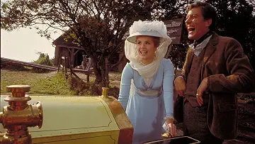 Dick Van Dyke, Sally Ann Howes, Heather Ripley, and Adrian Hall ride in the iconic flying car in the Chitty Chitty Bang Bang game.