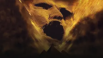 Brandon Fraser holding up a torch towards Imhotep, with Oded Fehr, in The Mummy (1999).