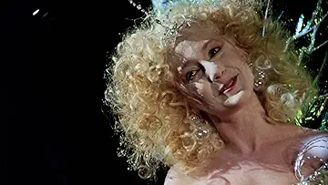 Christmas Present (Carol Kane) talks to Bill Murray's Frank Cross in the Scrooged game.