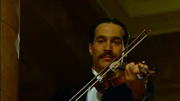 A family gathered around a dinner table in a warm, nostalgic scene from Barry Levinson's Avalon game.