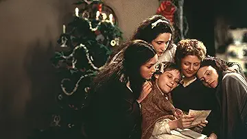 Winona Ryder's Jo March, Kirsten Dunst's Amy March, Susan Sarandon's Marmee March, Trini Alvarado's Meg March, and Claire Danes' Beth March read a letter in the Little Women (1994) game